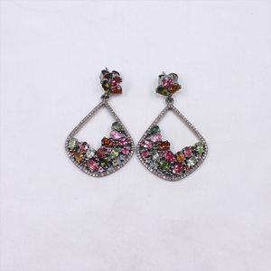 Pair of earrings with multicolored gemstones on a white background