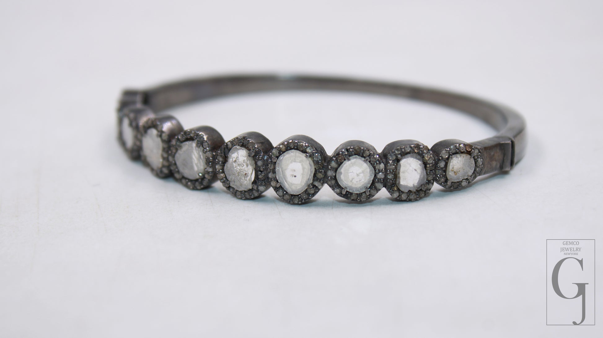 Vintage-style diamond bangle with handcrafted pave detailing