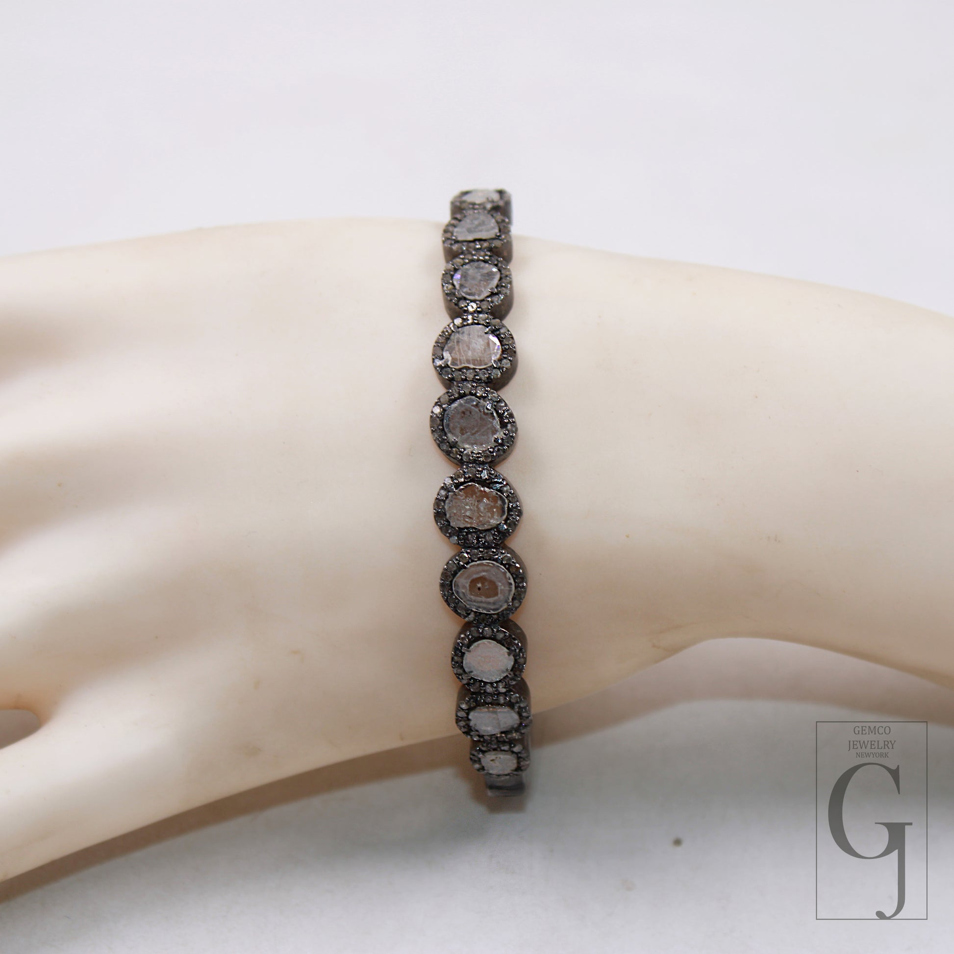 Designer silver bracelet featuring natural Polki diamonds