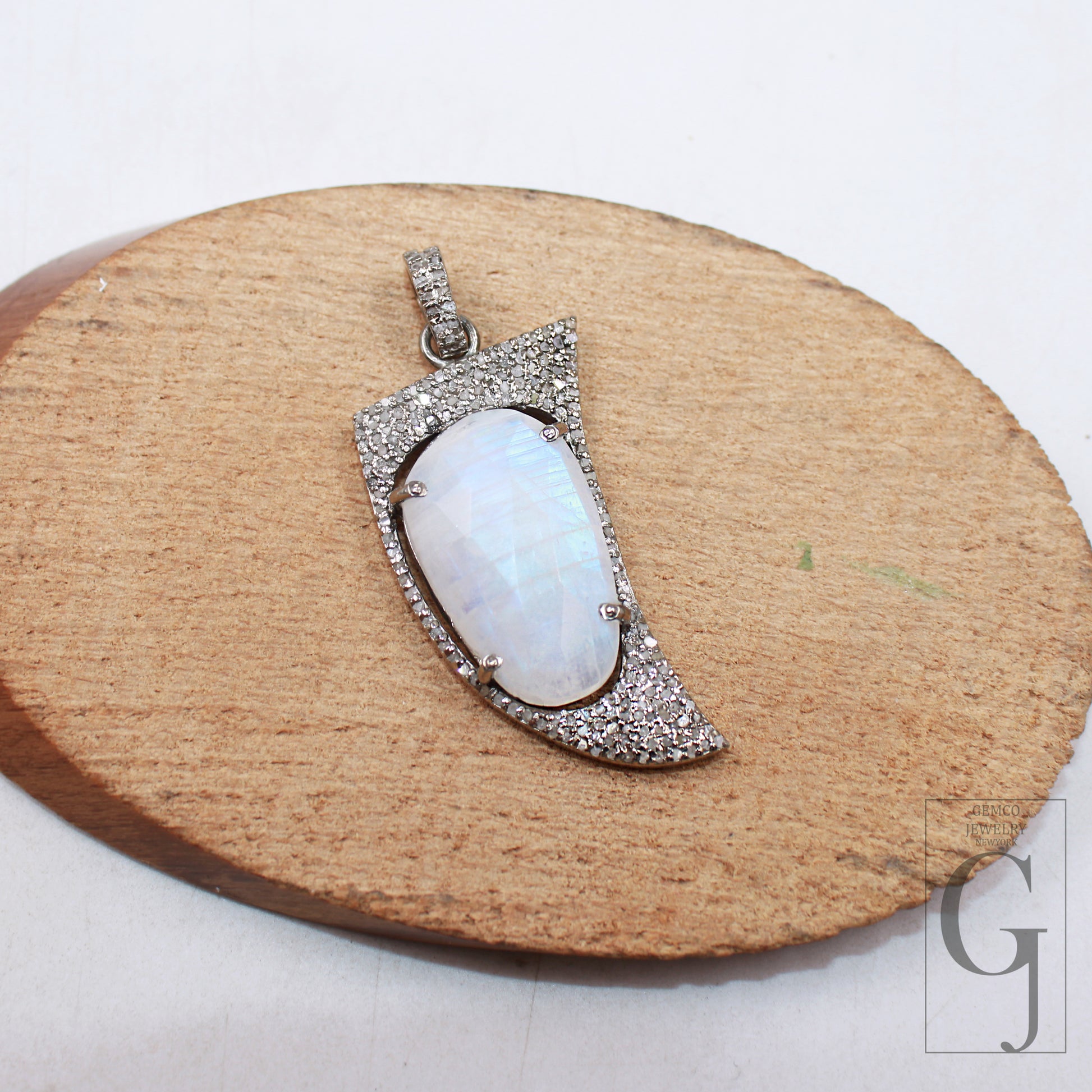 Natural moonstone pendant in shark tooth design