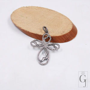 Handmade silver cross charm featuring rose cut diamonds