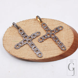 Silver cross charm with connected loop design and rose cut diamonds