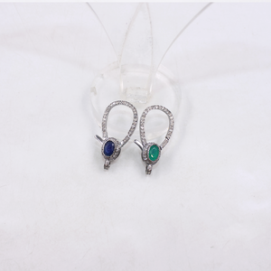 Pair of earrings with gemstones on a white background