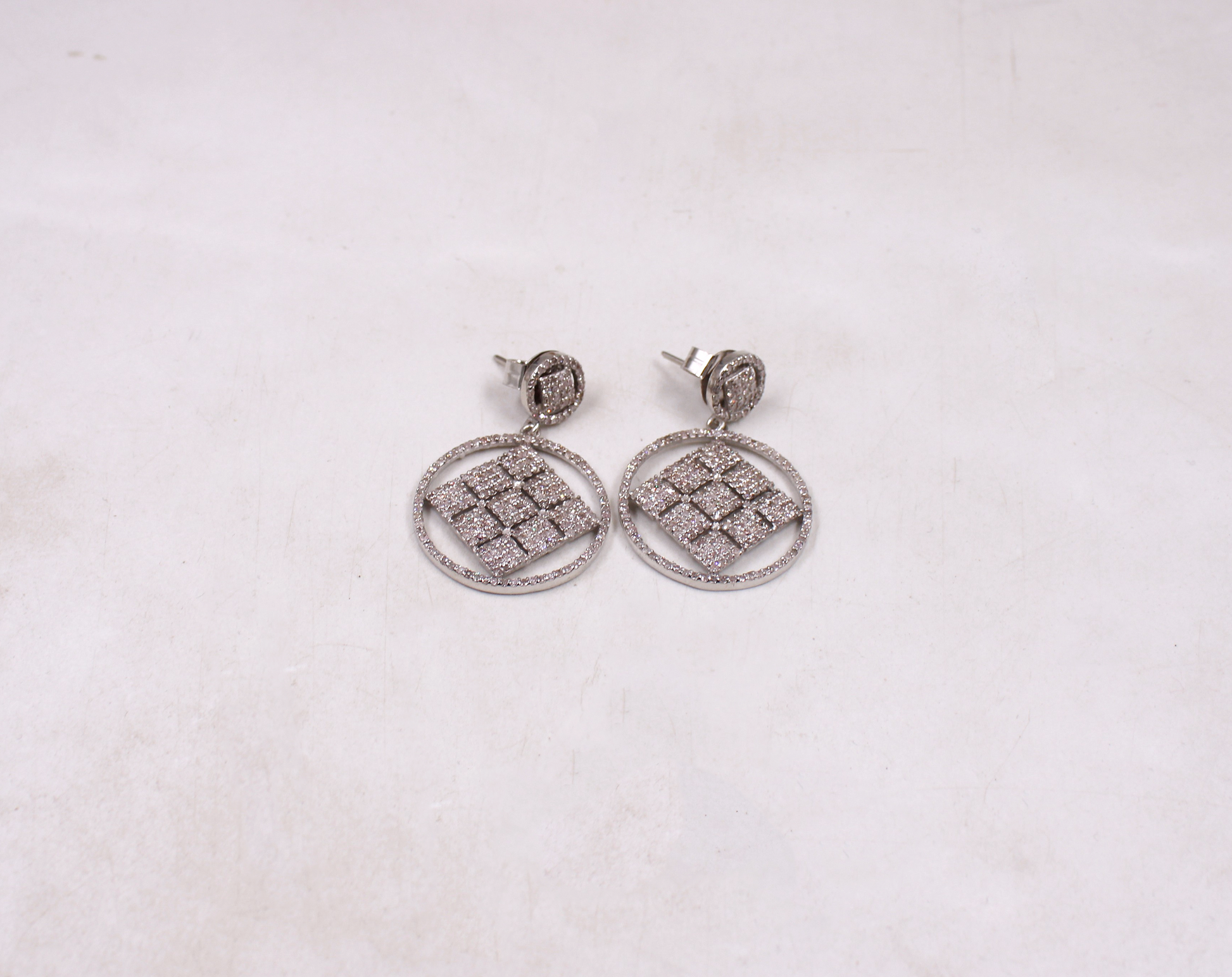 Modern geometric diamond drop earrings with artisan design