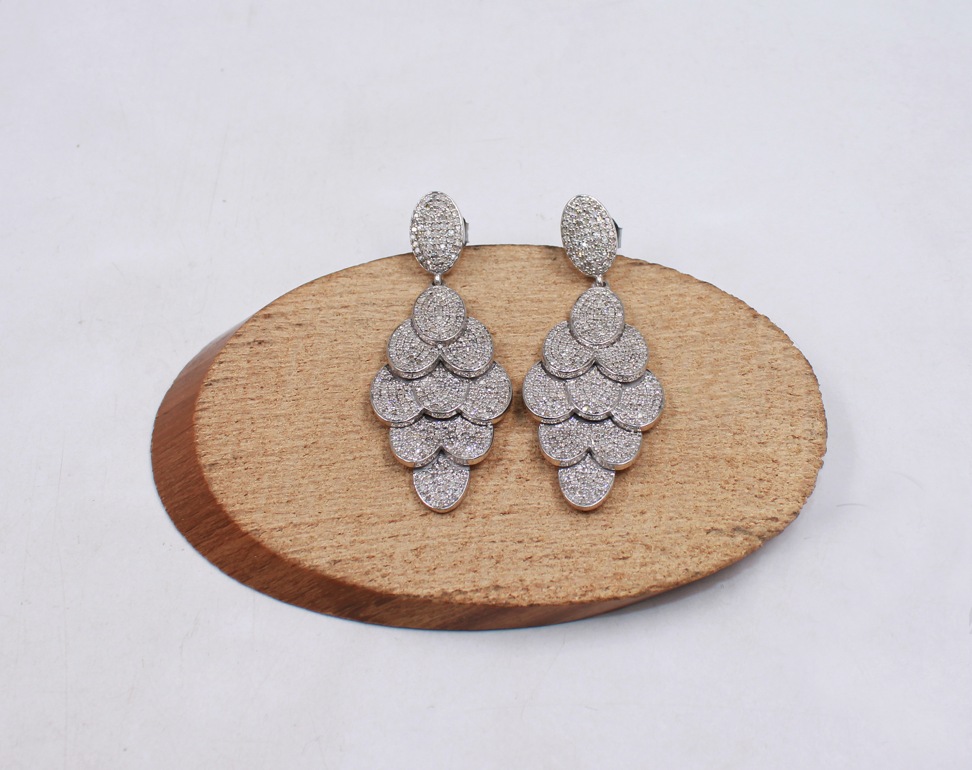 Handmade sterling silver earrings with high-polish rhodium finish and diamonds