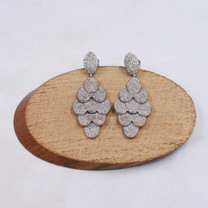 Handmade sterling silver earrings with high-polish rhodium finish and diamonds