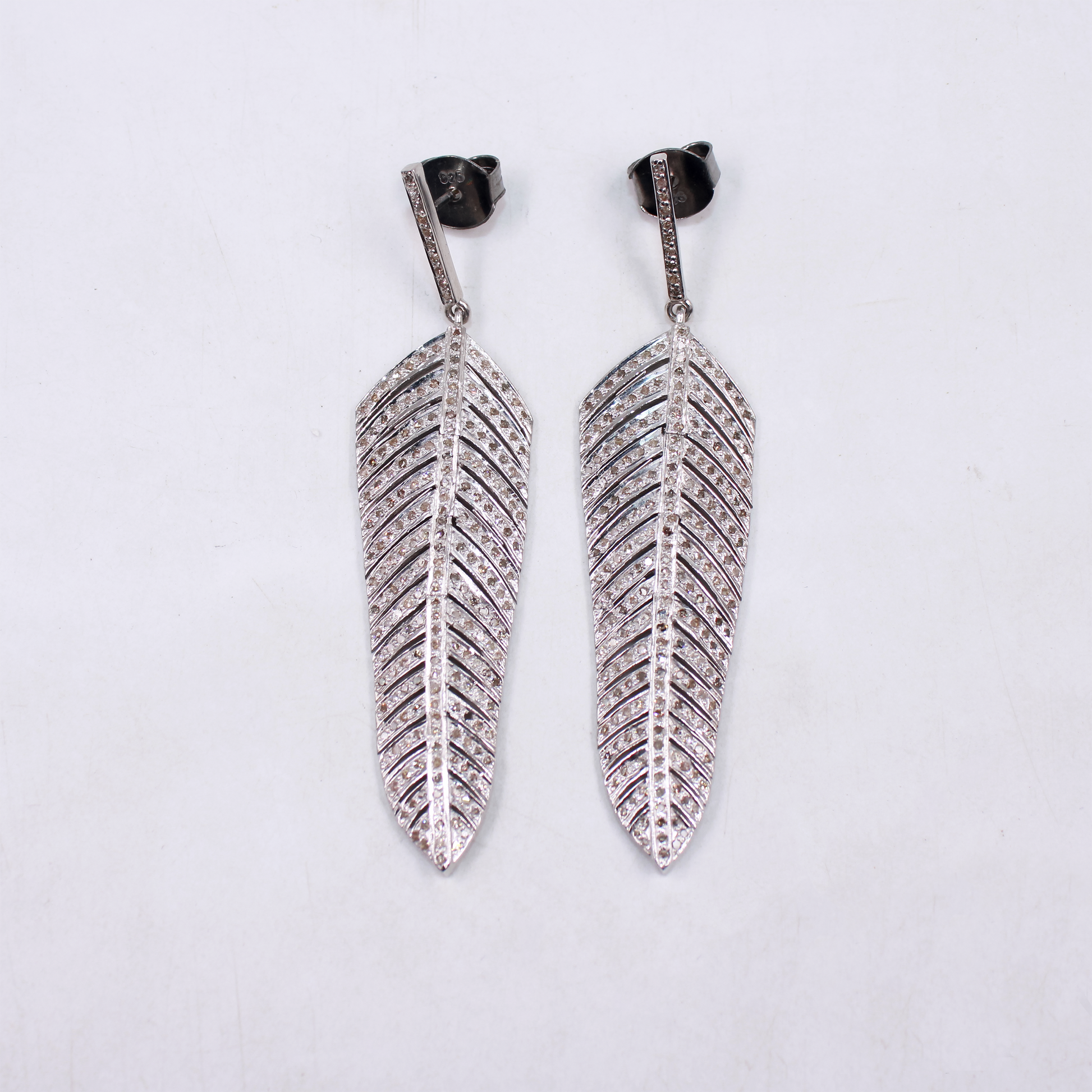 Long diamond feather earrings for weddings and events
