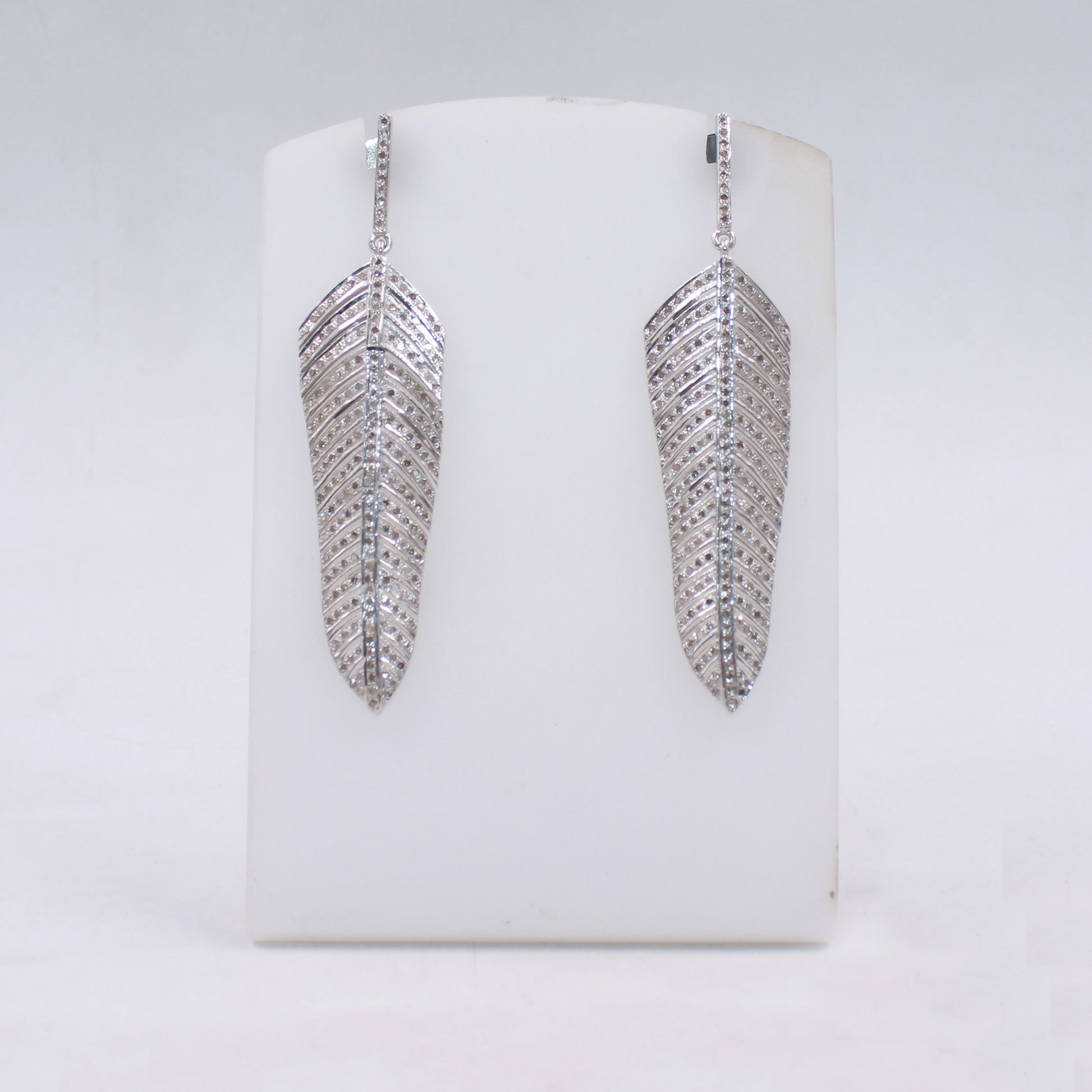 Handmade diamond feather earrings in sterling silver