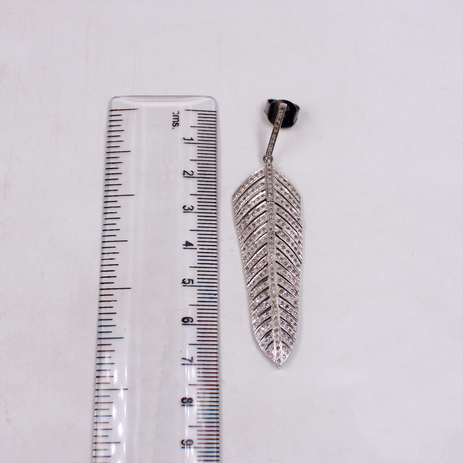 Sterling silver pave diamond feather dangle jewelry
