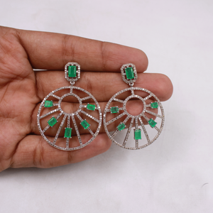 Green emerald drop earrings accented with sparkling diamonds