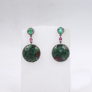 Collector’s gemstone earrings with artistic emerald and tourmaline design