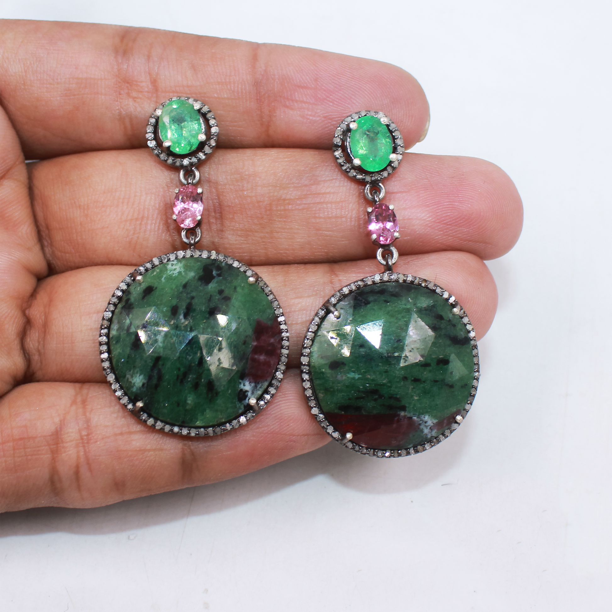 Artistic gemstone earrings in sterling silver with emerald and pave diamonds
