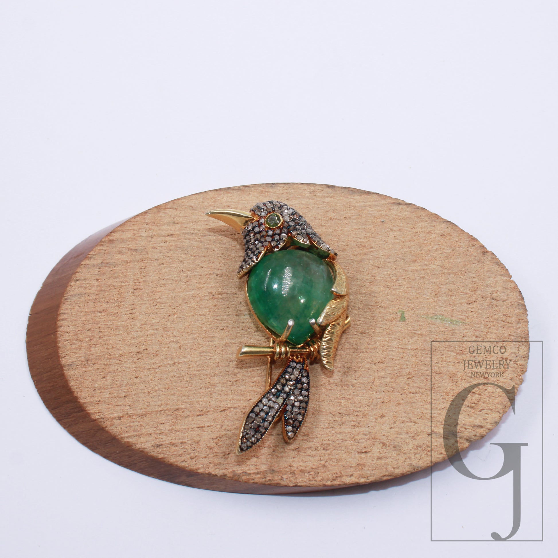 Handmade bird brooch with emerald cabochon and pave diamonds