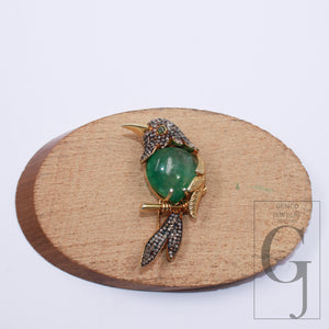 Handmade bird brooch with emerald cabochon and pave diamonds