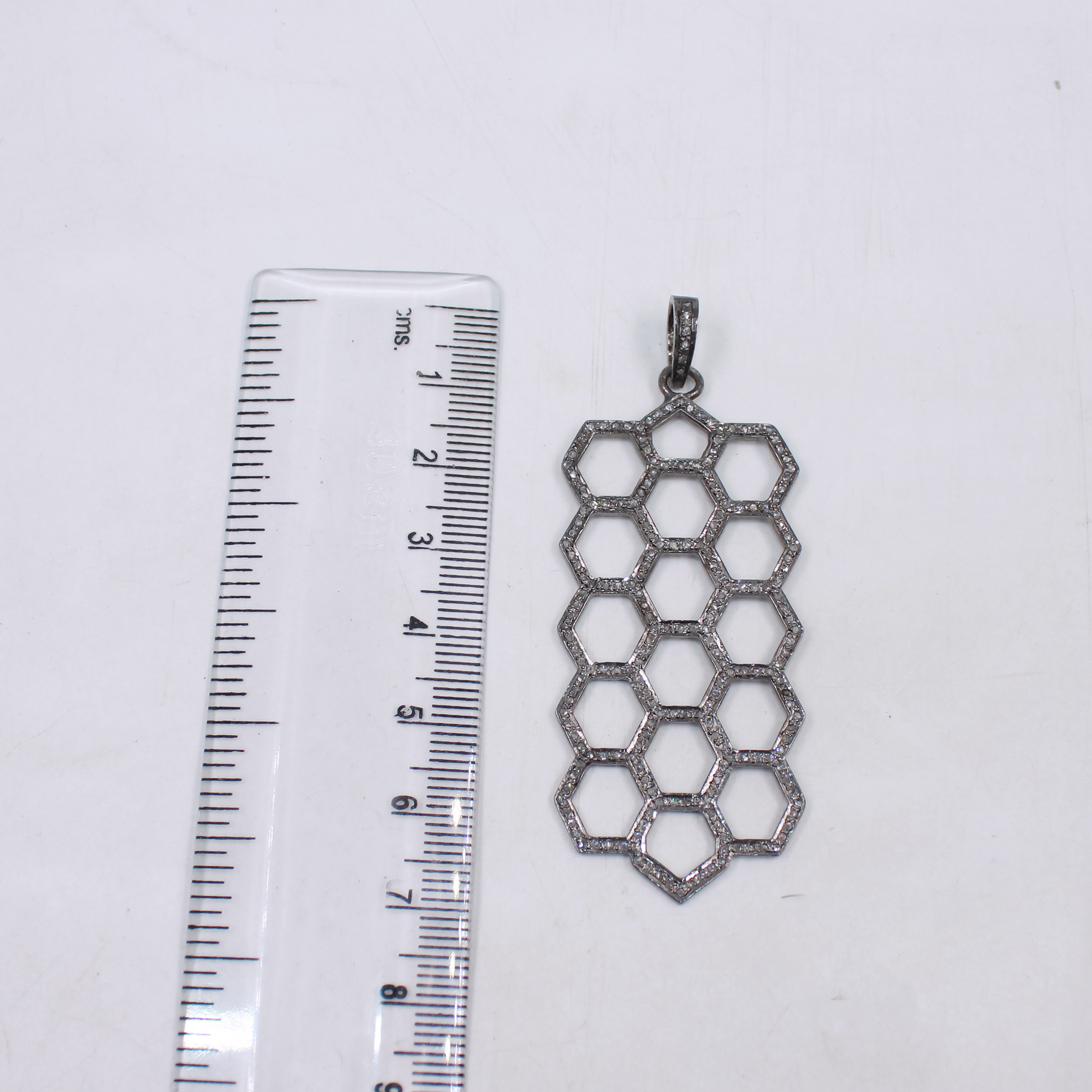 Long sterling silver pendant with natural rosecut diamonds