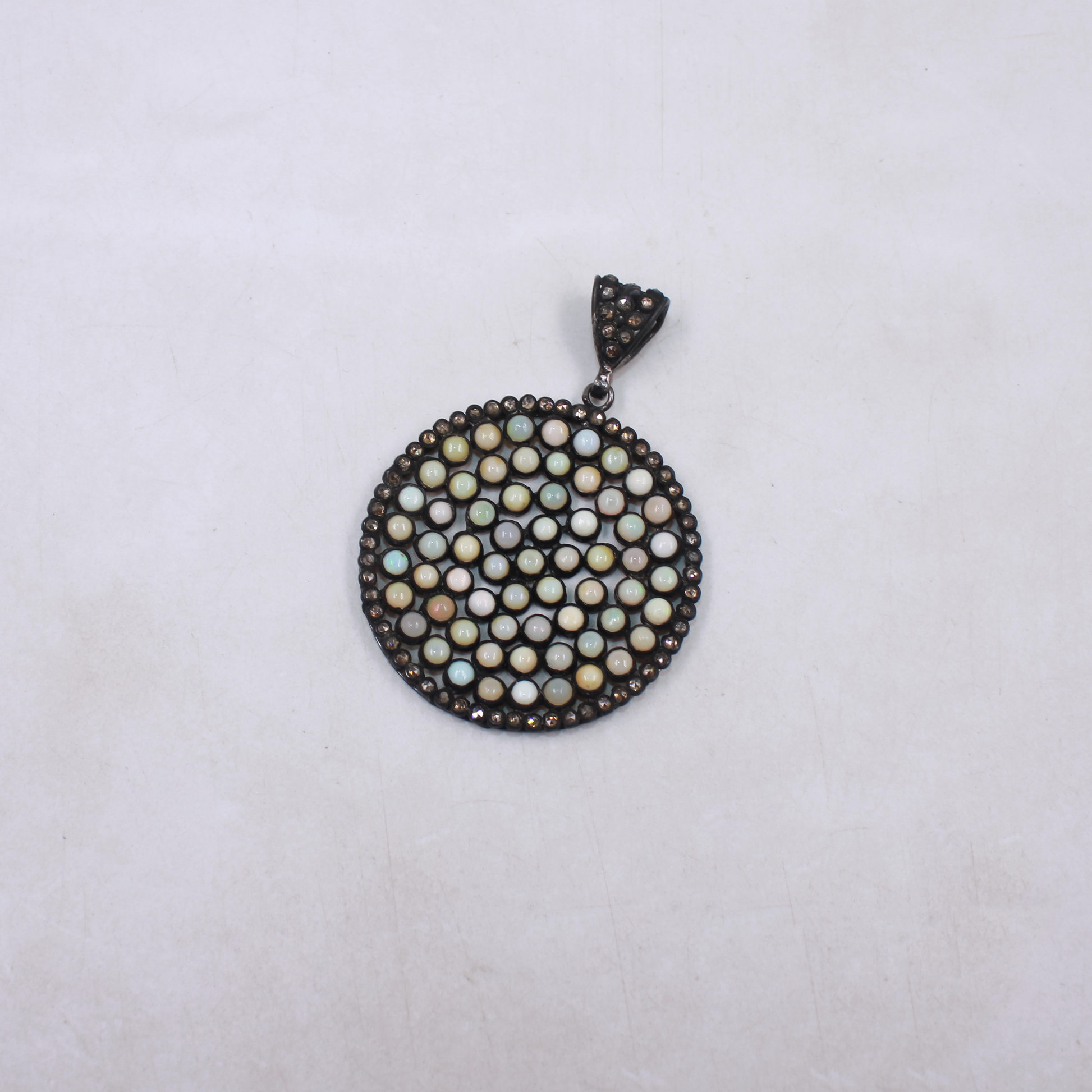 Handmade Ethiopian opal pendant with pave diamonds in sterling silver