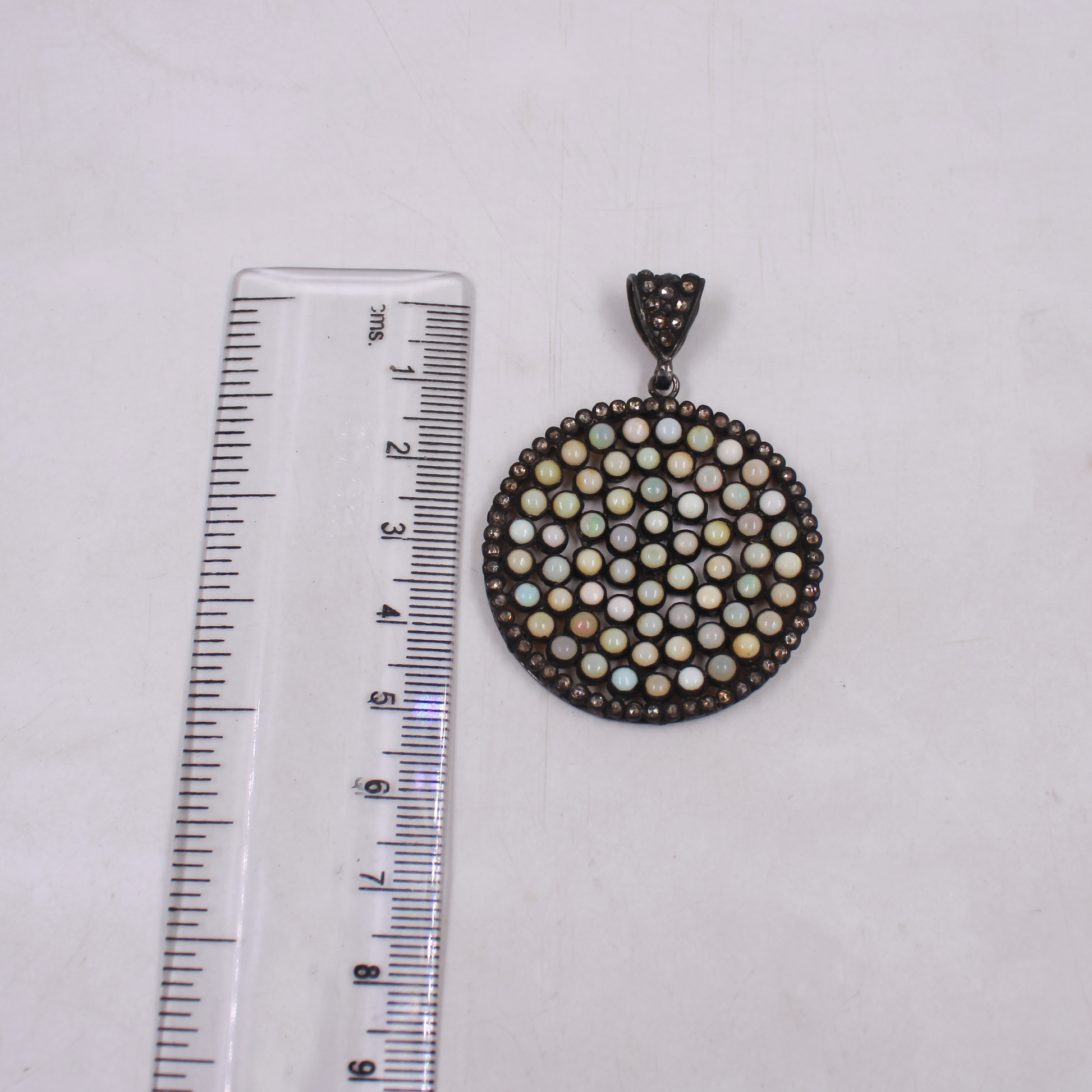 Circular opal pendant with natural pave diamond accents