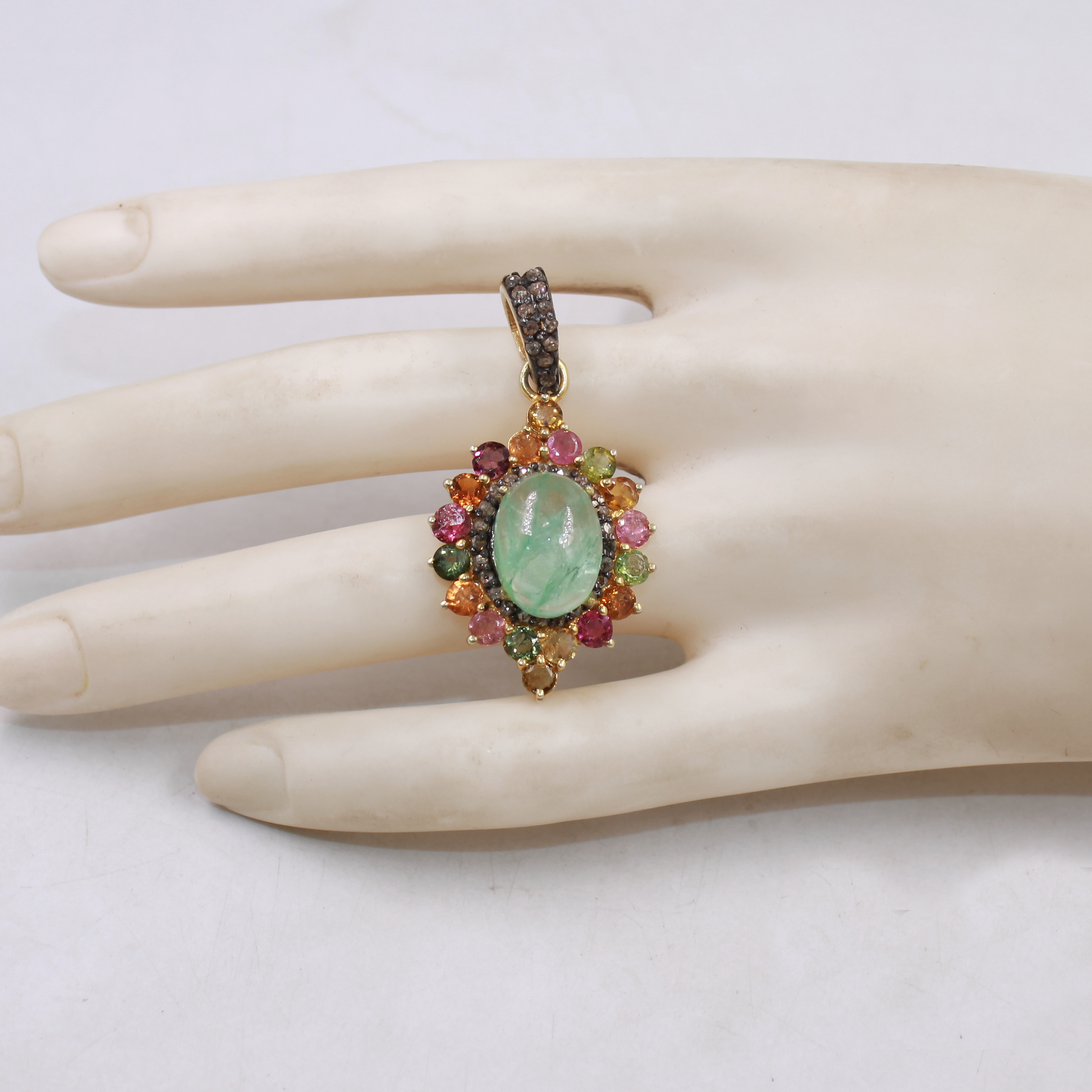Luxury Barriel emerald pendant accented with rosecut diamonds
