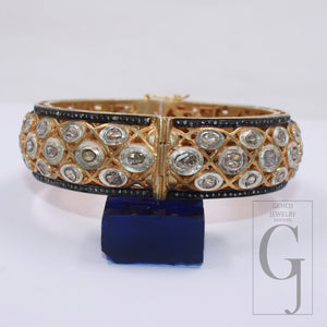 Close-up of antique-style Polki diamond bangle in 925 sterling silver