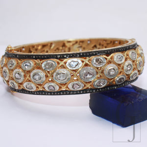 Detailed view of handmade silver bangle with rosecut diamonds