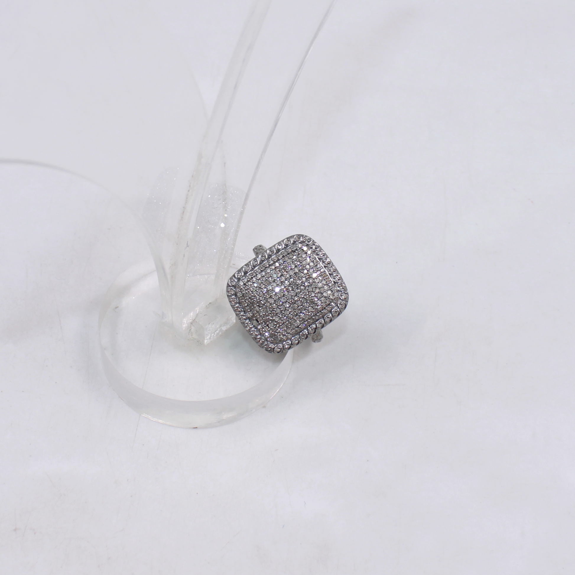Silver ring with gemstones on a white background