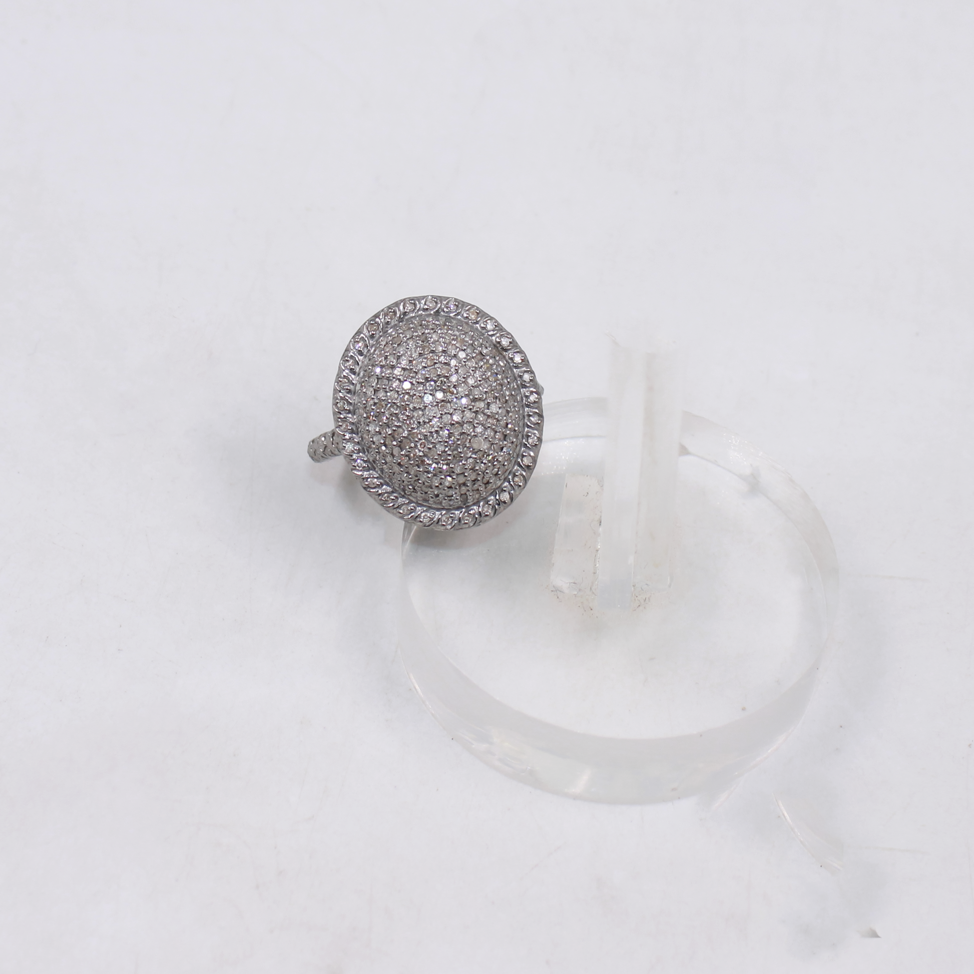 Silver ring with gemstones on a white background
