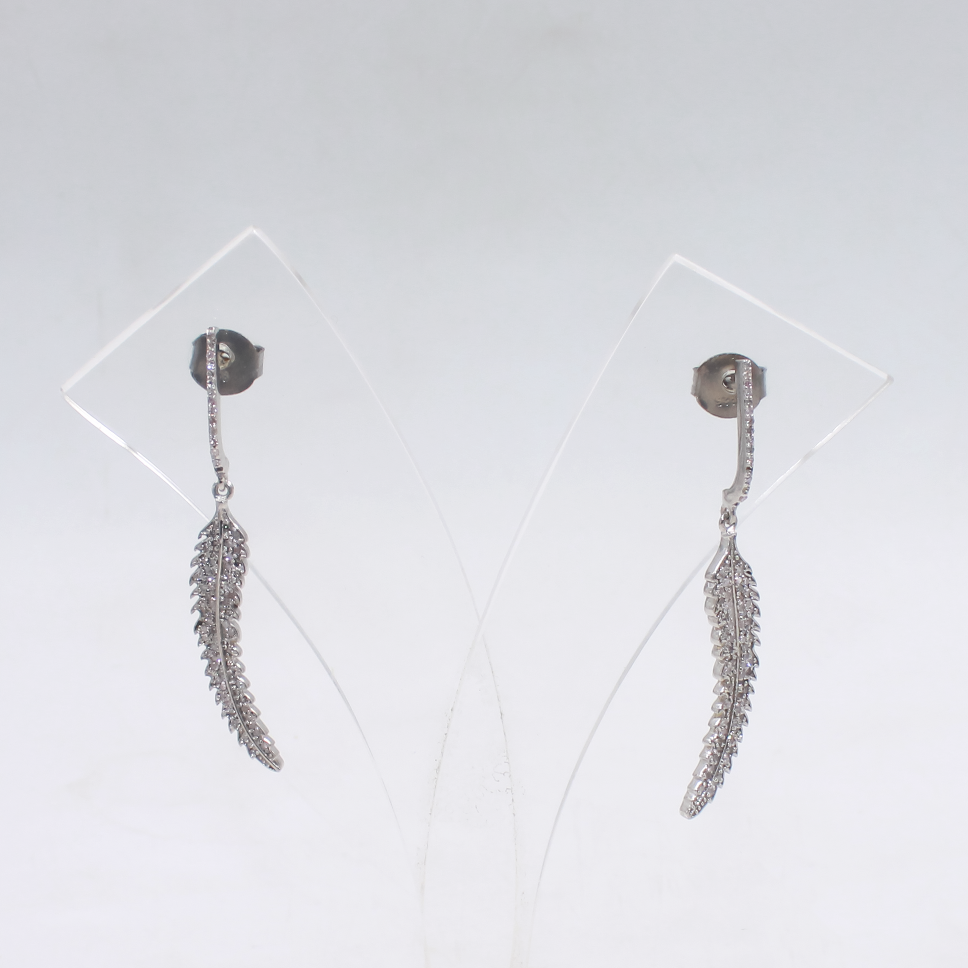 Nature-inspired sterling silver dangle earrings with diamonds