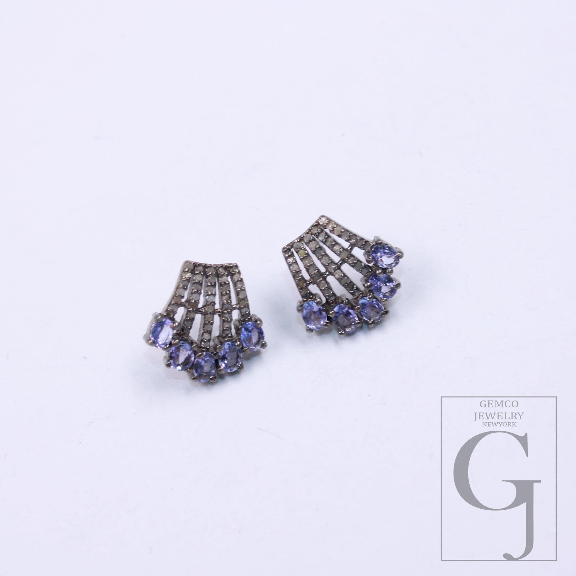 Tanzanite and diamond cluster studs