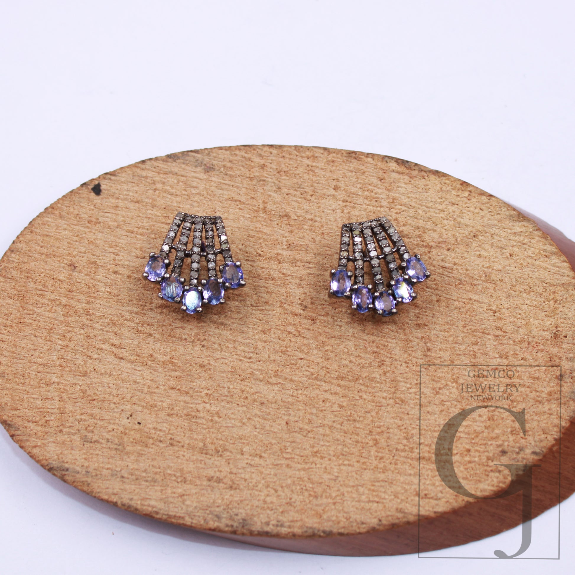 Close-up showing craftsmanship in 925 silver diamond and tanzanite earrings.