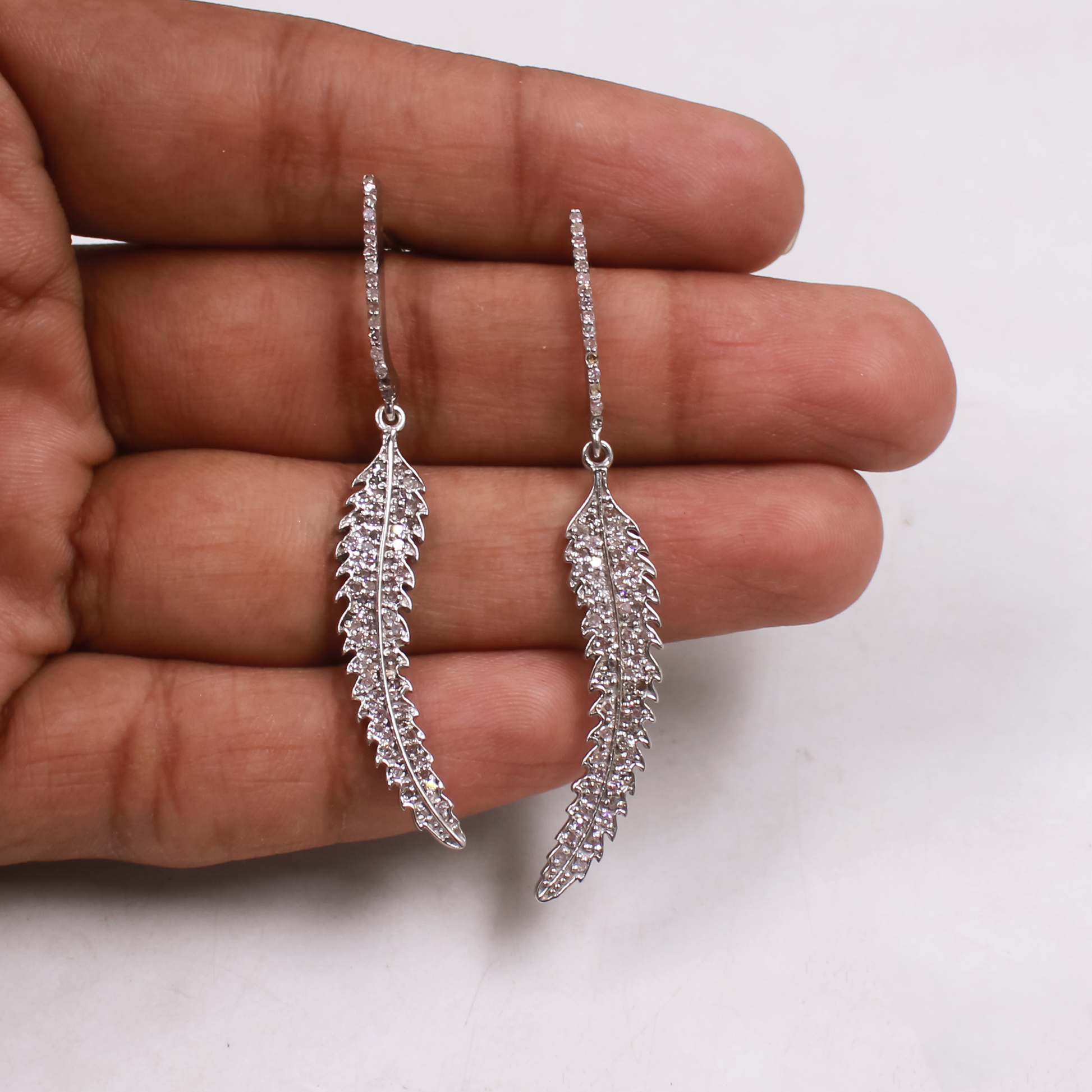 One-of-a-kind sterling silver earrings with natural diamonds