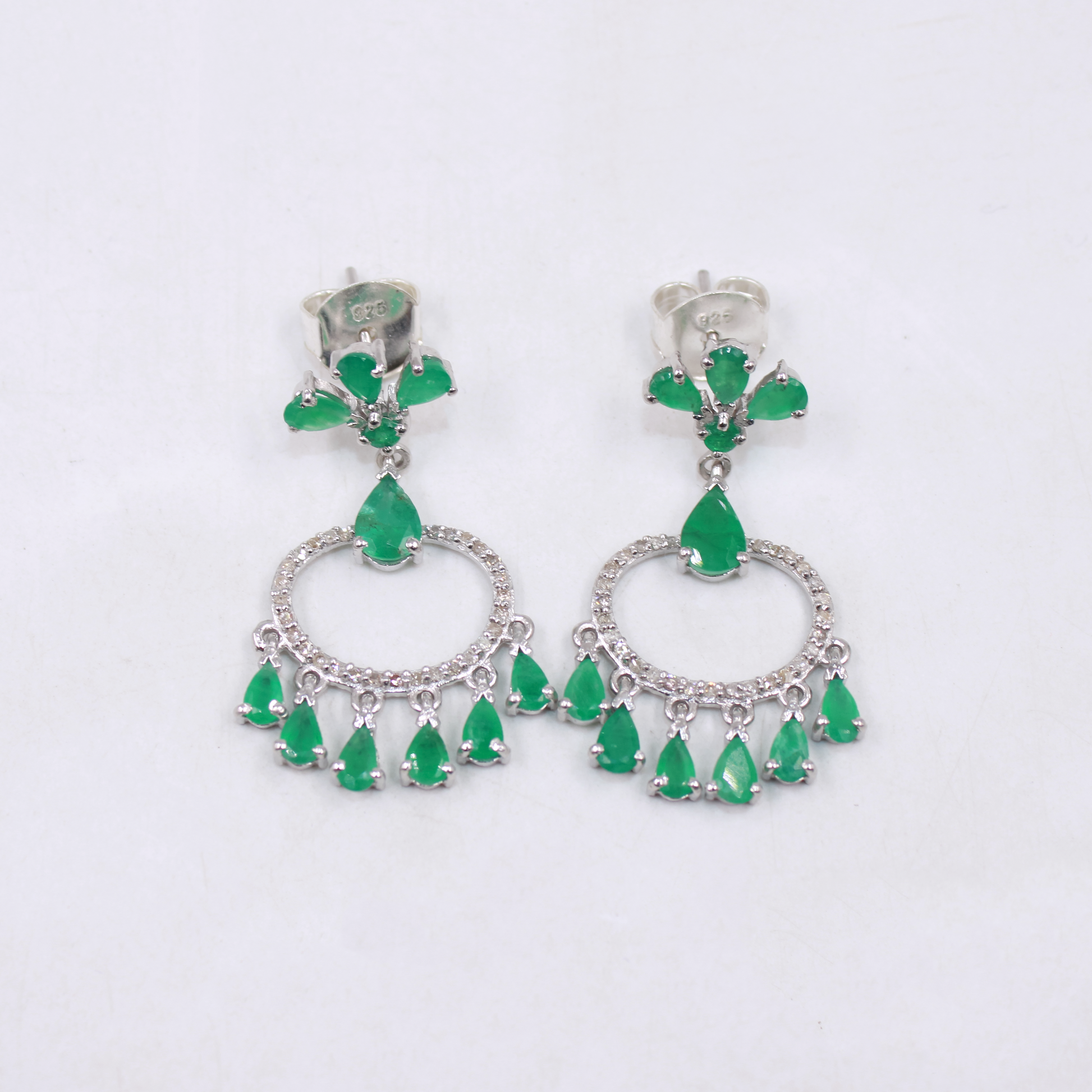 Emerald teardrop chandelier earrings in rhodium polished silver