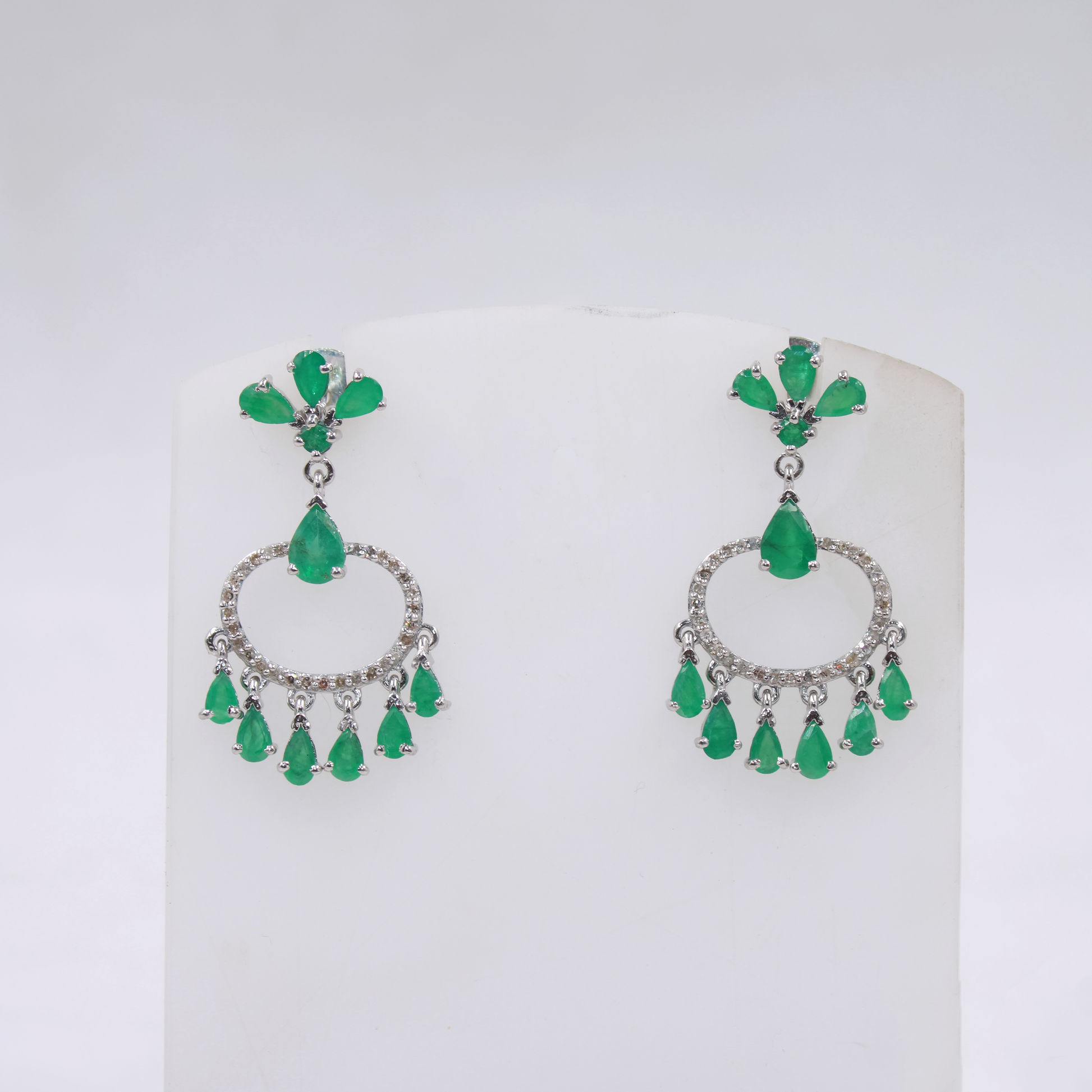 Artisan crafted emerald and diamond statement earrings
