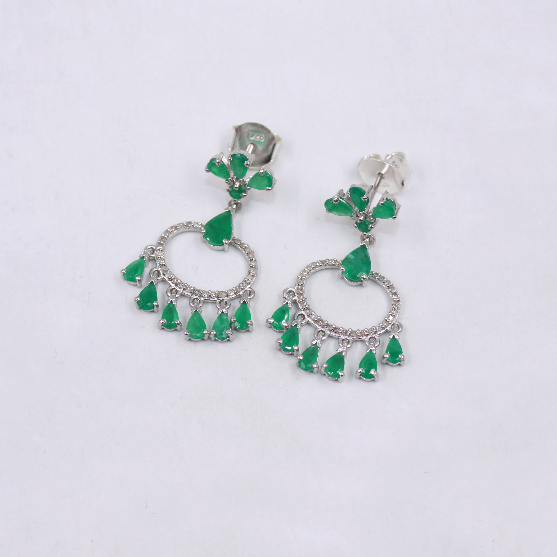 Sterling silver chandelier earrings with emeralds and diamonds