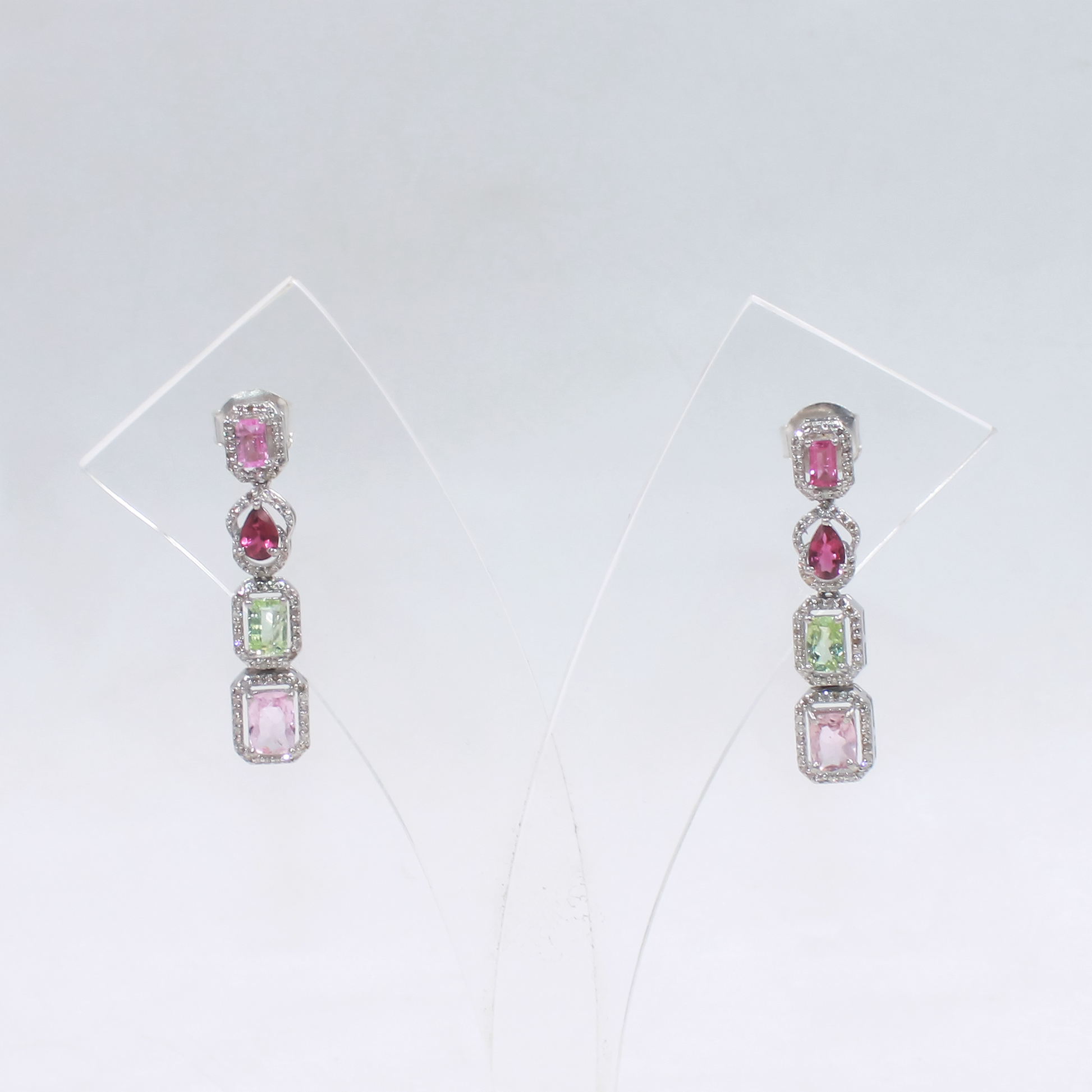 Elegant rhodium polished silver earrings with pave diamond accents