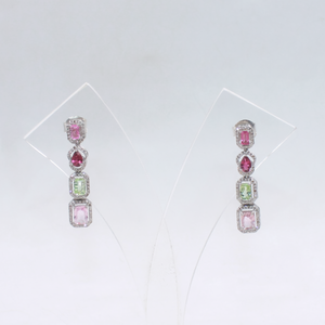 Elegant rhodium polished silver earrings with pave diamond accents