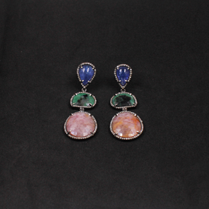 Unique gemstone jewelry featuring Tanzanite, Pink Sapphire, Emerald, and Diamonds