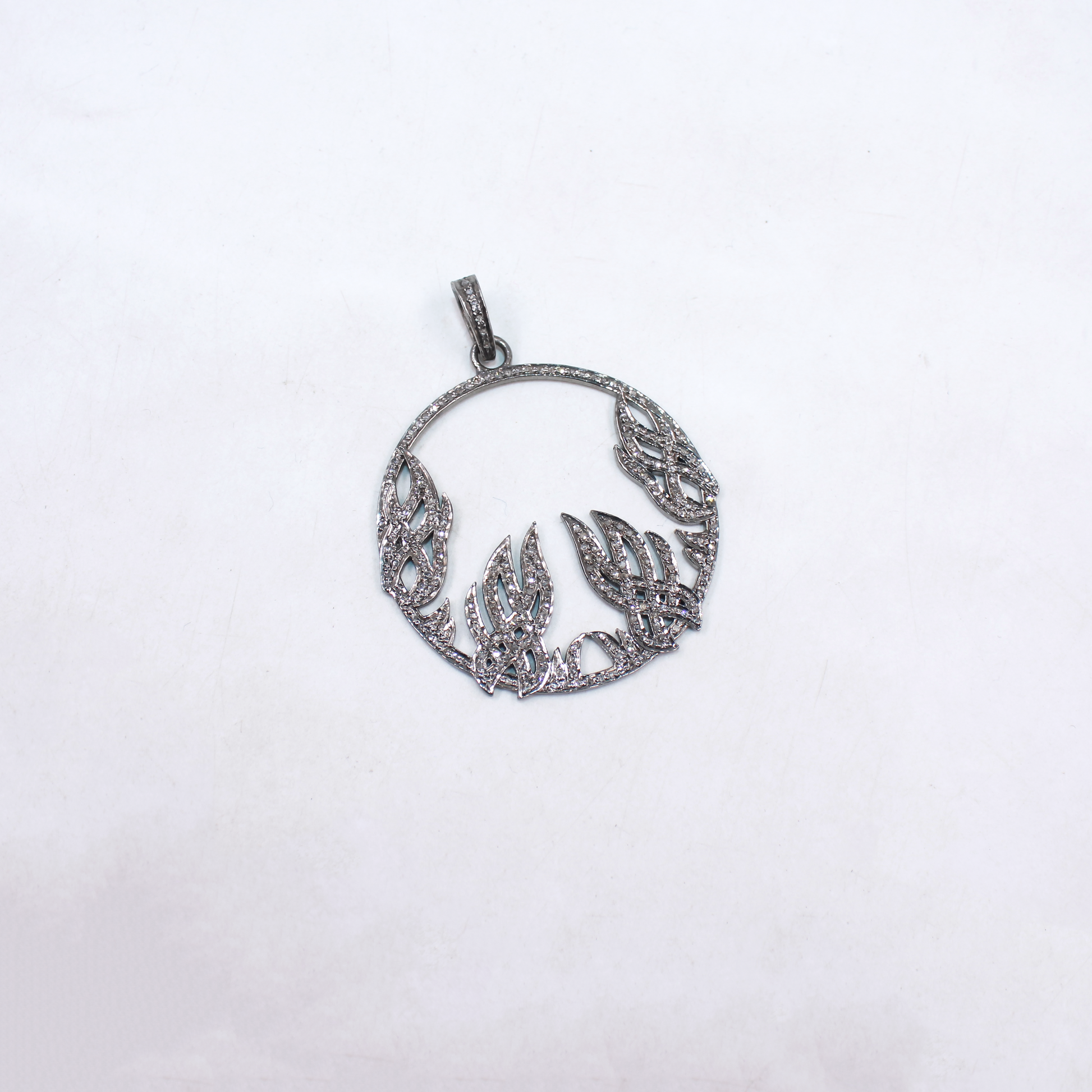 Artisan-crafted diamond pendant with sterling silver base