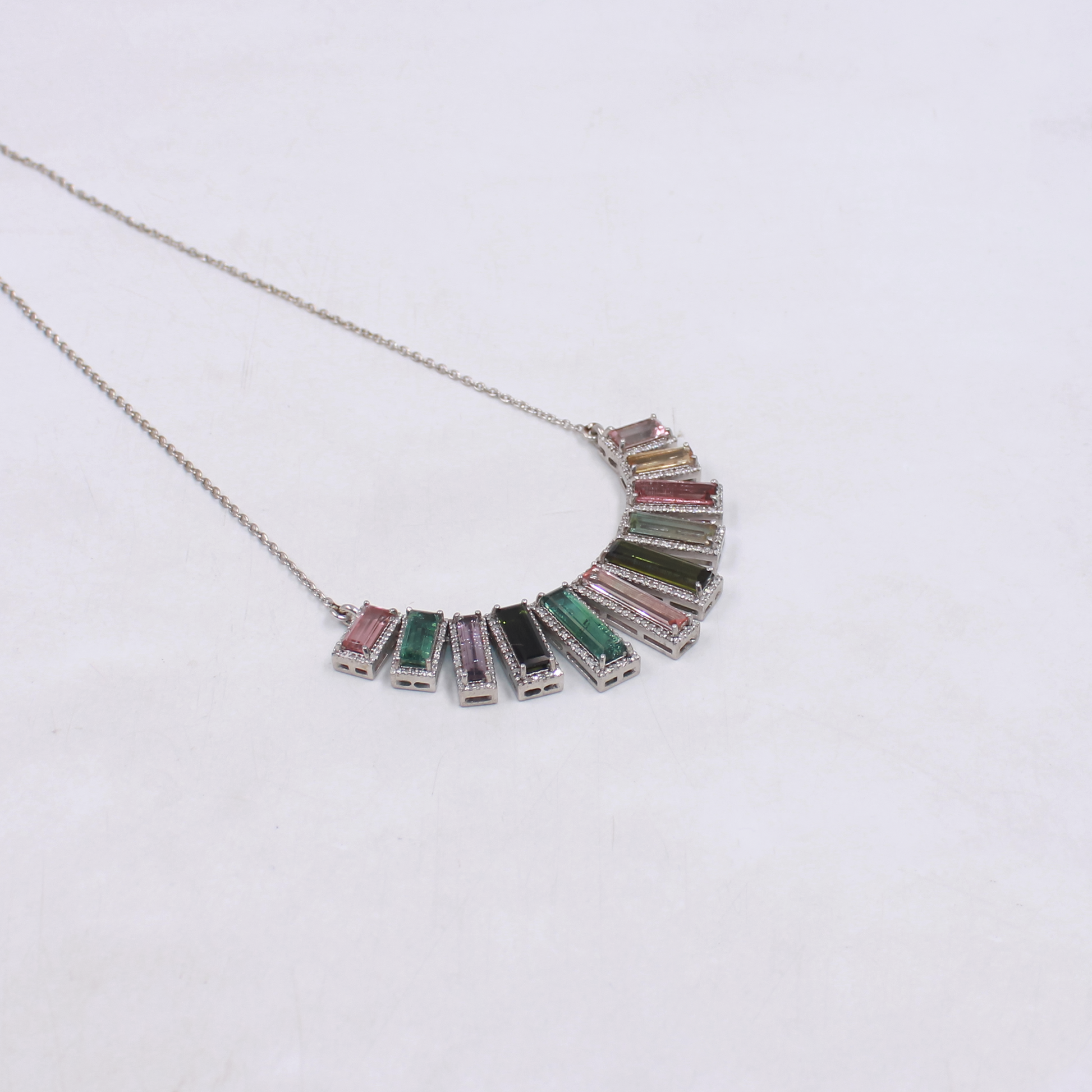 Statement necklace with baguette-cut tourmalines and pave diamonds