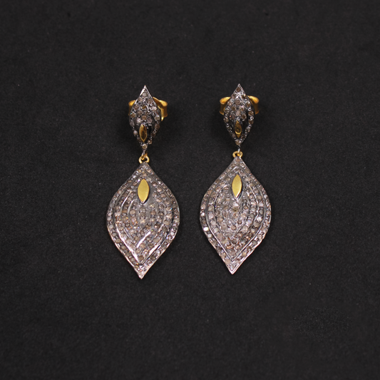 Pair of diamond earrings on a black background