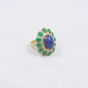 Bold gemstone cocktail ring featuring blue kyanite and green emeralds