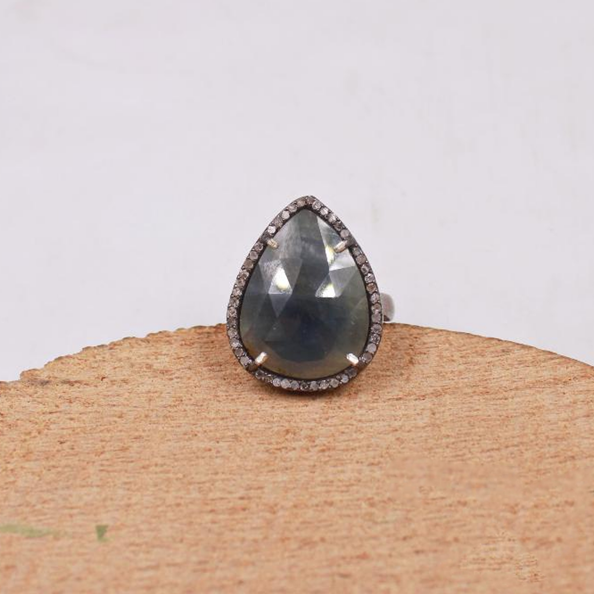 Pear shaped sapphire ring with conflict free pave diamonds