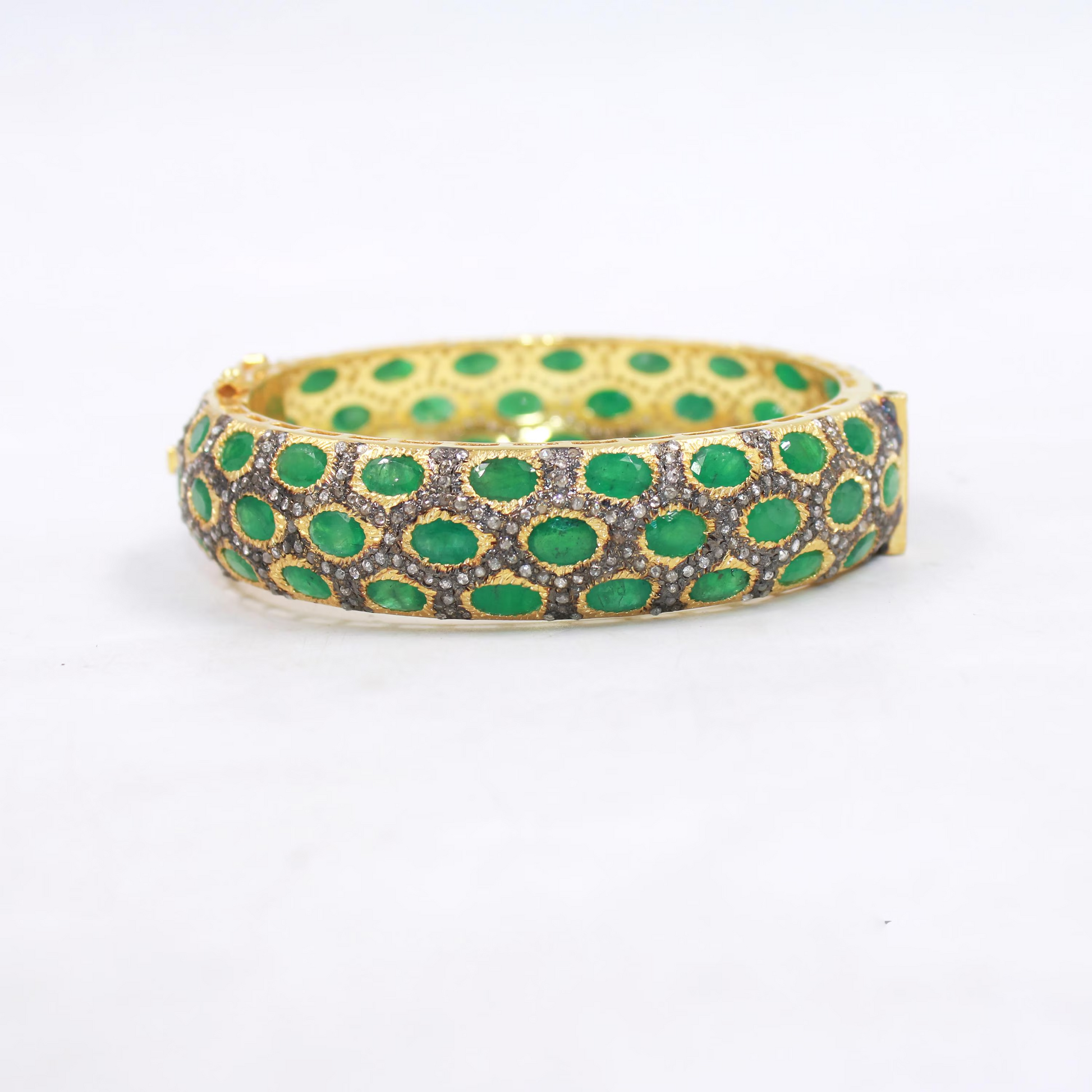 Gold plated sterling silver bangle with natural emeralds and diamonds