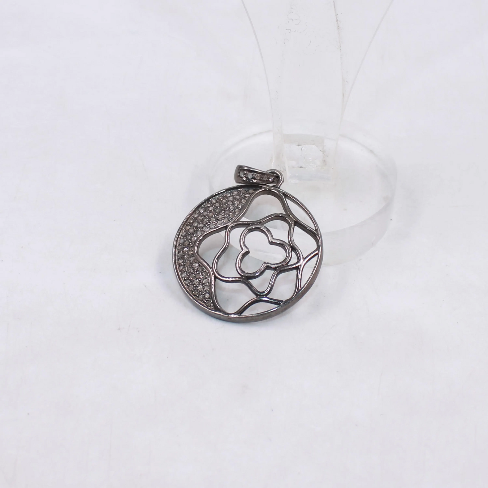 Silver floral pendant on a white background