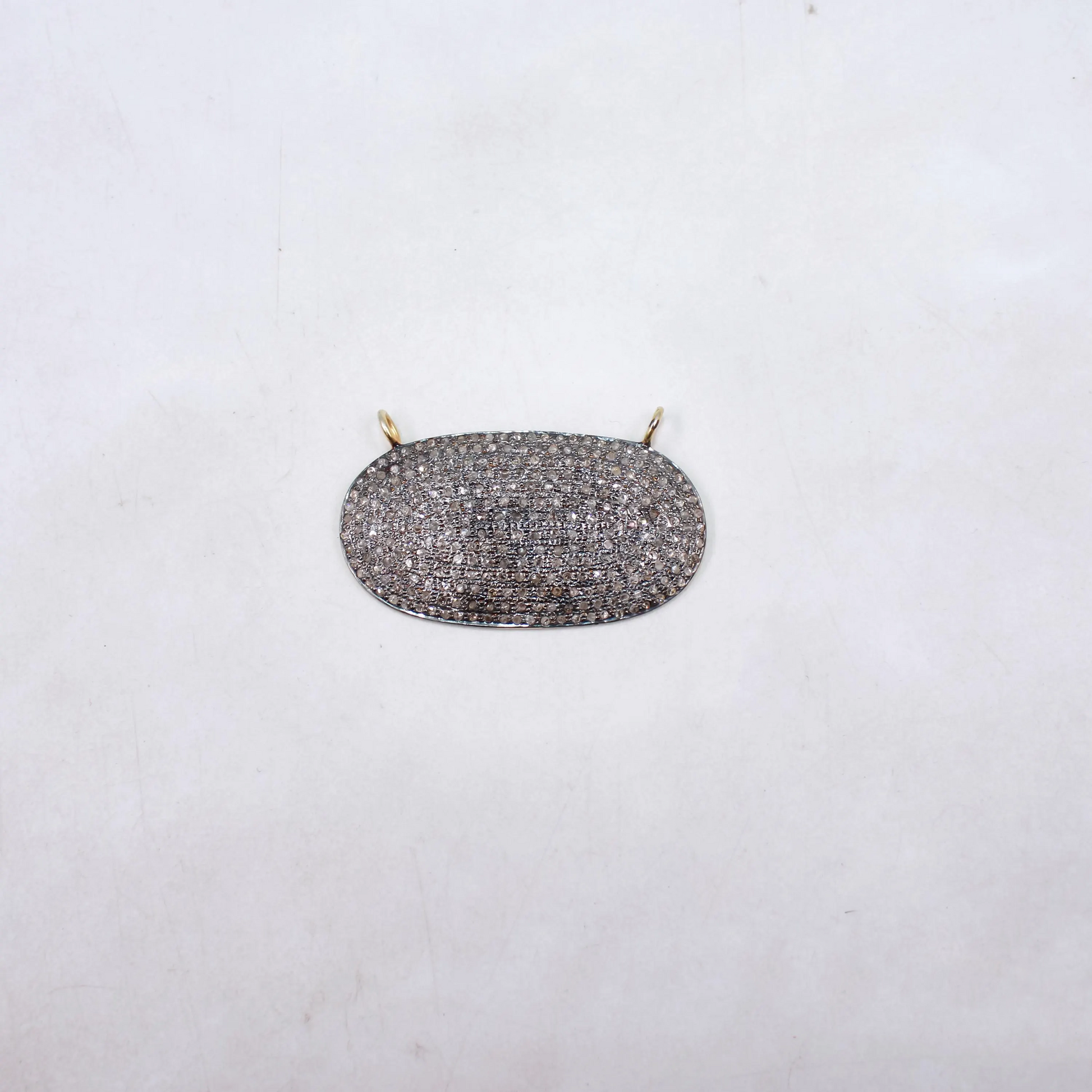 Silver necklace pendant on a white background