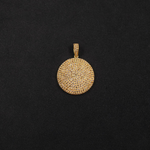 Gold pendant on a black background