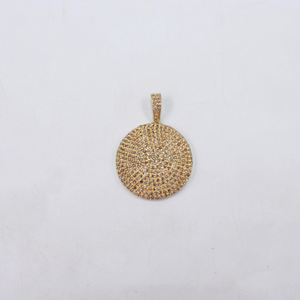 Gold circular pendant on a light gray background