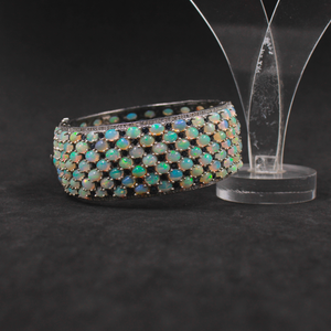 Opal bracelet on a black background