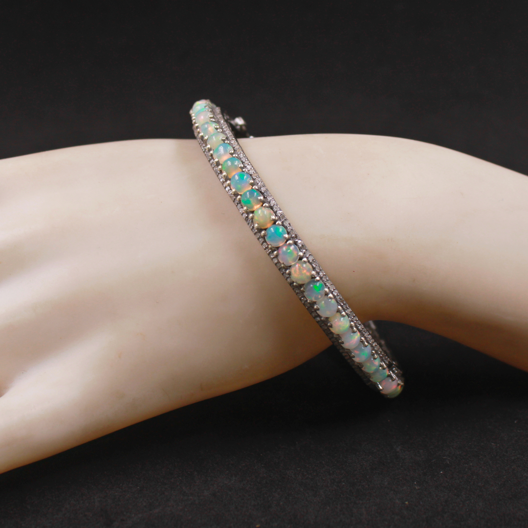 "Statement Luxury Bracelet Featuring Ethiopian Opals and Sterling Silver Craftsmanship"