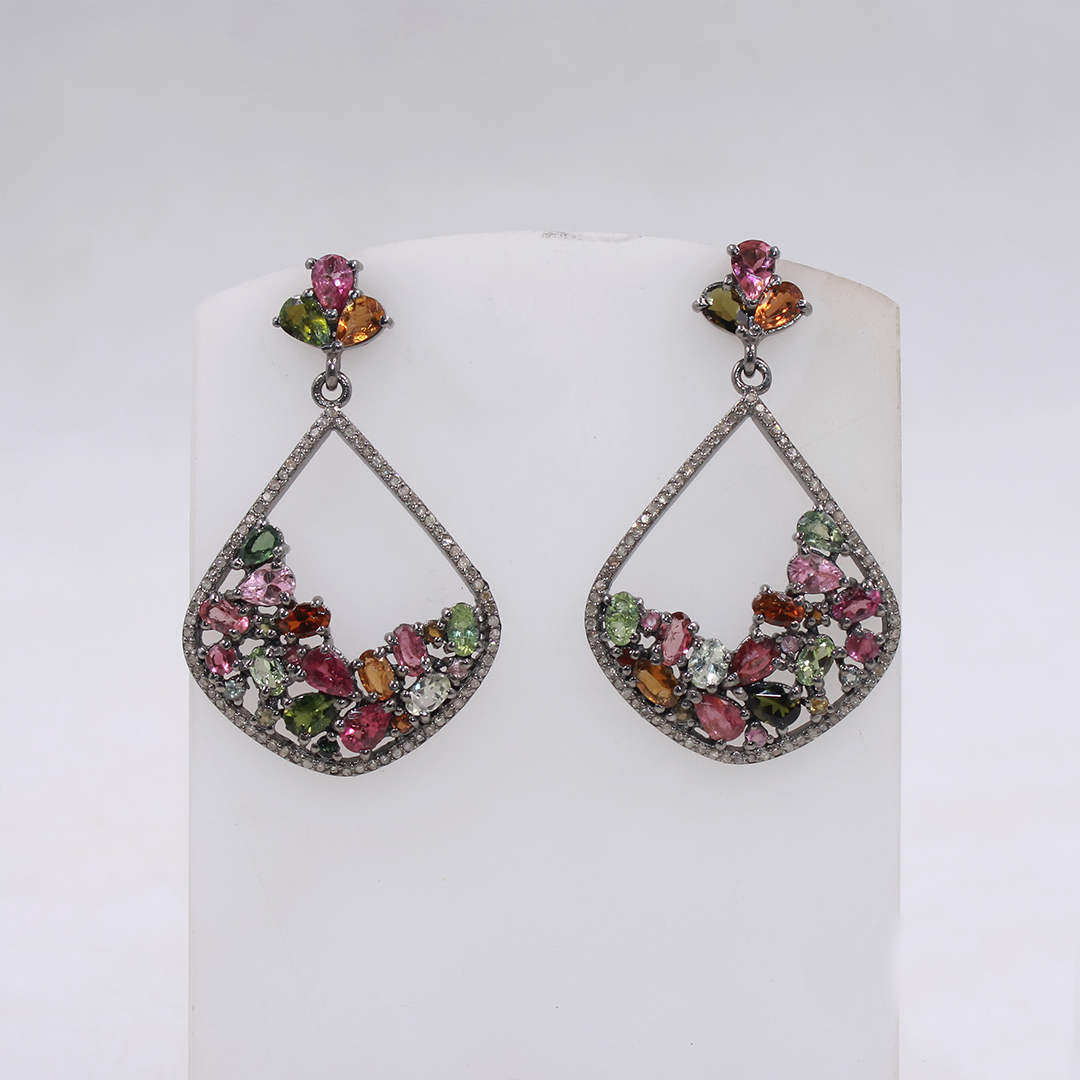 Pair of earrings with tourmaline gemstones on a white background