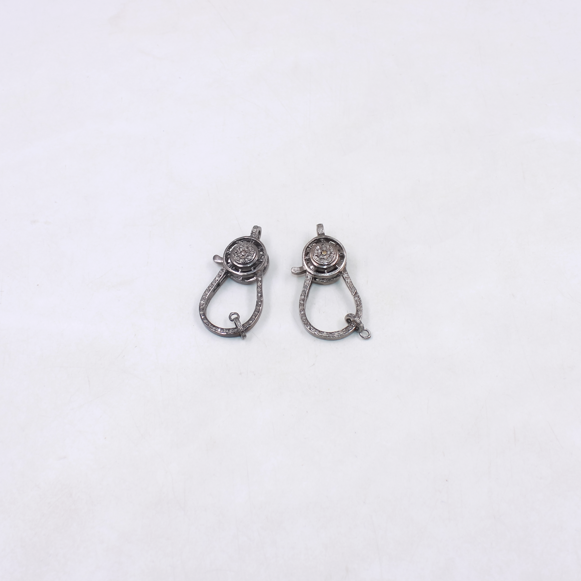 Handmade sterling silver clasp with rosecut diamond detailing